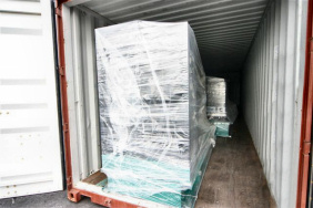 Generators loaded into a brown shipping container are bound for Dubai.
