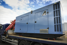 silenced 500kva generator loaded on a flat back lorry